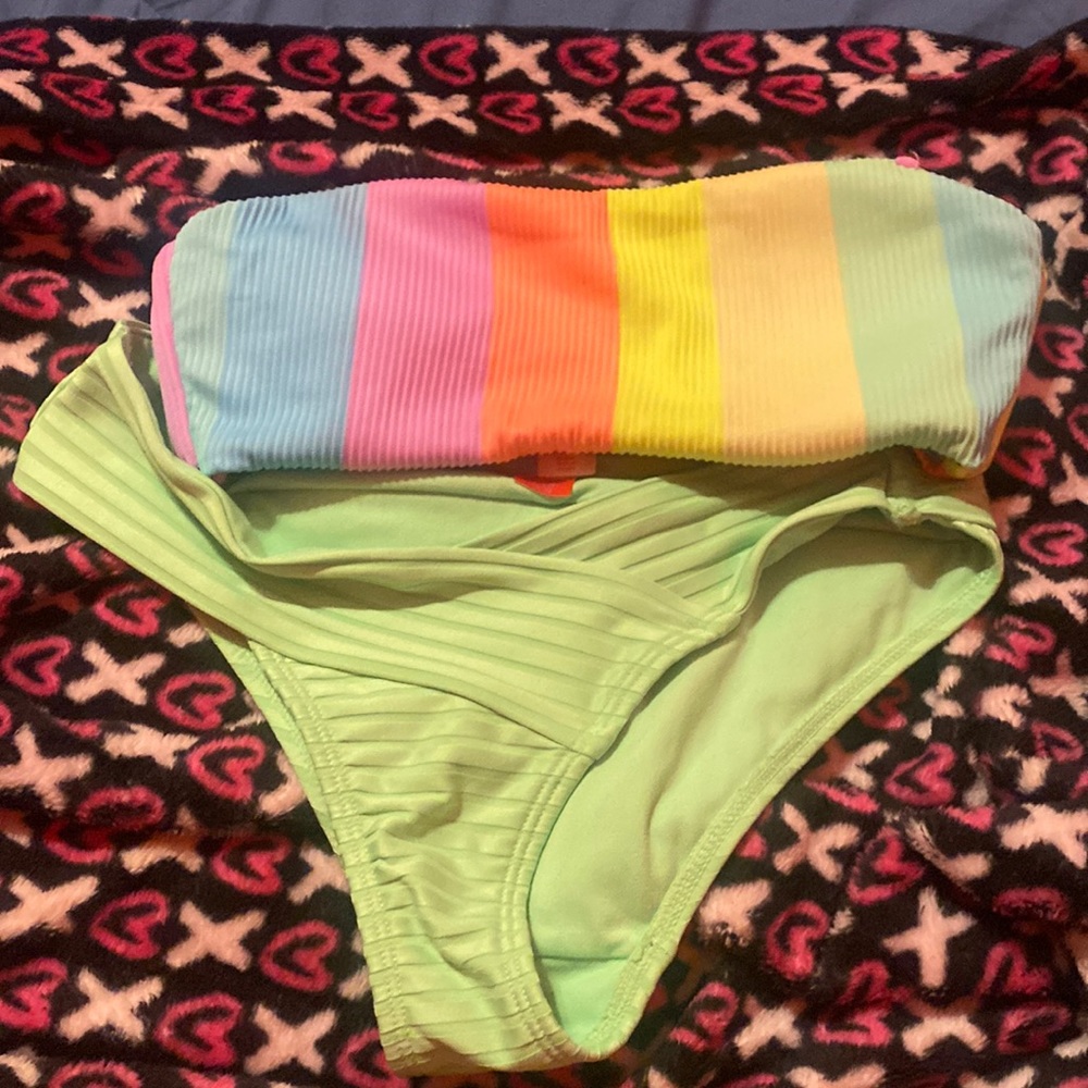 Green bikini bottoms and rainbow top